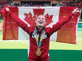 Canada's Rosie MacLennan, from King City, Ont., celebrates after winning the gold medal in the trampoline gymnastics competition at the 2016 Summer Olympics Friday, August 12, 2016 in Rio de Janeiro, Brazil. (THE CANADIAN PRESS/Ryan Remiorz)