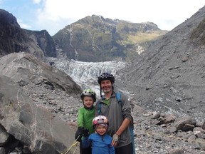 Ed Gillis poses with his sons, Heron and Sitka, in front of New Zealand’s Fox Glacier. (Photo courtesy of Ed Gillis)