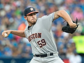 Houston Astros starting pitcher Joe Musgrove throws against the Toronto Blue Jays during the first inning of their American League MLB baseball game in Toronto on Friday, August 12, 2016. (THE CANADIAN PRESS/Fred Thornhill)