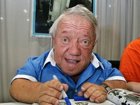 In this Saturday, May 26, 2007 file photo, actor Kenny Baker, who portrayed R2-D2 in the first Star Wars movie, signs autographs at Star Wars Celebration IV, billed as the world's biggest Star Wars party, marking the 30th anniversary of the release of the first film in the Star Wars saga, at the Los Angeles Convention Center. Baker has died Saturday, Aug. 13, 2016. (AP Photo/Reed Saxon, File)
