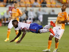Toronto FC forward Jozy Altidore watches his diving header go wide against the Houston Dynamo during the first half of an MLS soccer match Sunday, Aug. 14, 2016, in Houston. (AP Photo/Bob Levey)