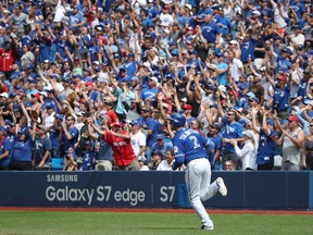 Troy Tulowitzki #2 of the Toronto Blue Jays circles the bases as he hits a three-run home run in the fifth inning during MLB game action against the Houston Astros on August 14, 2016 at Rogers Centre in Toronto. (Tom Szczerbowski/Getty Images)