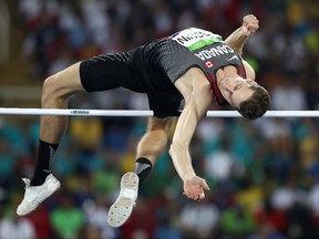 Derek Drouin of Canada competes in the Men's High Jump qualification on Day 9 of the Rio 2016 Olympic Games at the Olympic Stadium on August 14, 2016 in Rio de Janeiro, Brazil.  (Photo by Cameron Spencer/Getty Images)