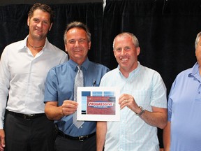 Partners behind the new naming rights deal for Sarnia's premier twin-pad arena -- now called the Progressive Auto Sales Arena -- celebrated the milestone Monday. Pictured here are city manager Marg Misek-Evans, Sting co-owner Derian Hatcher, city arenas manager Rob Harwood, and Dan Whitton and John Whitton, of Progressive Auto Sales. Barbara Simpson/Sarnia Observer/Postmedia Network