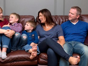 Australian au pair Kimberley Spence, left, poses for photos with the Shaw family Paige, Chase, Finn, and Dana in Calgary on Sunday, Aug. 14, 2016. THE CANADIAN PRESS/Larry MacDougal