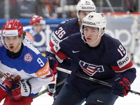 Russia’s Artemi Panarin, left, follows a puck with Jimmy Vesey, of the United States, right, during the World Championship semifinal in Prague May 16, 2015. (THE CANADIAN PRESS/AP, Petr David Josek)