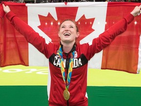 Canada's Rosie MacLennan, from King City, Ont., celebrates after winning the gold medal in the trampoline gymnastics competition at the 2016 Summer Olympics Friday, August 12, 2016 in Rio de Janeiro, Brazil.THE CANADIAN PRESS/Ryan Remiorz