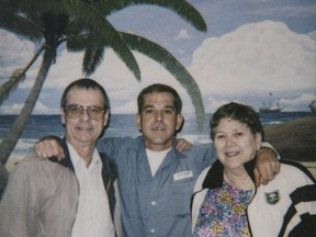 The federal government has approved the transfer of a Canadian jailed for 30 years in Florida prisons for a murder committed when he was 18 years old. Davies, centre, poses for with his parents, Richard Davies, right, and Carol Davies as they visit their son in a Florida prison in this April 2005 handout photo. THE CANADIAN PRESS/HO