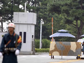 A South Korean navy soldier stands guard at a naval base in Jinhae, South Korea, Tuesday, Aug. 16. 2016. An accidental explosion happened during repair work on a submarine at a naval base in the southeast of the country, South Korean officials said. (Park Jung-hyun/Yonhap via AP).