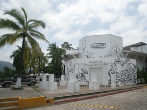 The entrance of the restaurant "La Leche" stands closed after armed men abducted as many as 16 people who were dining in the upscale restaurant in Puerto Vallarta, Mexico, Monday, Aug. 15, 2016. Jalisco state prosecutor Eduardo Almaguer said in a news conference that preliminary results of the investigation indicate that all involved, kidnappers and kidnapped, were members of criminal organizations. (AP Photo/David Diaz)