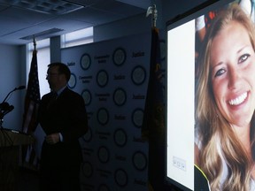 In this July 26, 2016, file photo, a picture of Kaylee Sawyer is displayed on a screen as Deschutes County District Attorney John Hummel speaks during a press conference at the Deschutes County Courthouse in Bend, Ore. The murder of Kaylee Sawyer followed by a string of other crimes leading from Oregon through California allegedly committed by Central Oregon Community College safety officer Edwin Lara has this scenic mountain town deeply shaken. (Joe Kline/The Bulletin via AP, file)