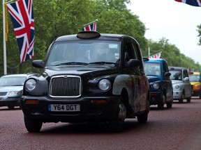 To compete with ride-sharing services like Uber, London’s iconic black cabs must start accepting credit cards by October. (DOMINIC ARIZONA BONUCCELLI PHOTO)