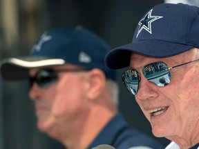 In this July 29, 2016, file photo, Dallas Cowboys owner Jerry Jones answers a question with executive vice president Stephen Jones, left, during the "state of the team" press conference at the start of the NFL football team's training camp in Oxnard, Calif. (AP Photo/Gus Ruelas, File)
