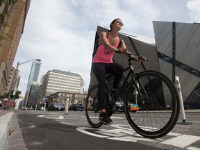 A cyclist on the Bloor St. bike lanes. (STAN BEHAL/Toronto Sun)