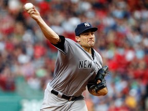 New York Yankees starting pitcher Nathan Eovaldi delivers a pitch against the Boston Red Sox at Fenway Park in Boston Wednesday, Aug. 10, 2016. (AP Photo/Winslow Townson)