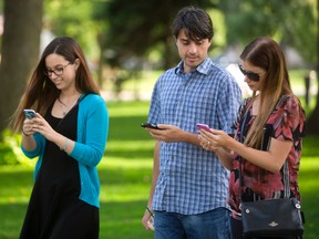 Younger adults, like these Pokemon Go players in London’s Victoria Park, may be more likely to fall prey to online scams, a Better Business Bureau survey shows. (MIKE HENSEN, The London Free Press)