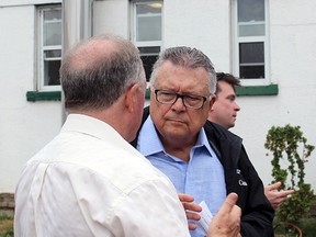 Ralph Goodale, Minister of Public Safety and Emergency Preparedness, finishes his tour of Collins Bay Institution's former farming facilities. Julia Balakrishnan/For The Whig-Standard)
