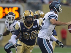 Jason Vega, shown here chasing down Argos QB Ricky Ray in 2014, was at Eskimos practice on Tuesday. (Kevin King)