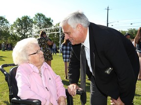 Geoffrey Lougheed, of the Sudbury Food Bank, talks with Lily Fielding at Fun Day at Kivi Park at the site of the former Long Lake Public School in Sudbury, Ont. on Tuesday August 16, 2016. John Lappa/Sudbury Star/Postmedia Network