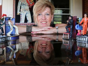 Tim Miller/The Intelligencer
Elaine Vannest shows off some of the Elvis memorabilia she uses to decorate her home during the Tweed Tribute to Elvis Festival on Wednesday. Vannest is one of many residents who billets Elvis Tribute Artists in their homes for the festival.