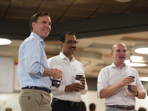 From left, Federal Finance Minister Bill Morneau handed out coffee at Burrow Café along with the Honourable Amarjeet Sohi, Minister of Infrastructure and Communities and Member of Parliament for Edmonton Mill Woods, and Randy Boissonnault, Parliamentary Secretary to the Minister of Canadian Heritage and Member of Parliament for Edmonton Centre on August 17, 2016.