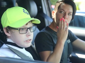 Jonathan Pitre, says goodbye to his family as he leaves his Russell home Wednesday with his mother for a bone marrow transplant operation in Minnesota. Julie Oliver/Postmedia