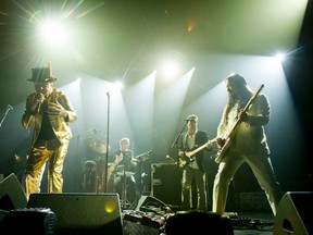 Gord Downie and The Tragically Hip perform in Calgary on Aug. 1. Columnist Lisa Ray was a classmate of some of the band members at Kingston Collegiate. (Lyle Aspinall/Postmedia Network)