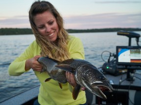 Ashley Rae with a lake trout she caught while fishing from her new boat.
(Supplied photo)