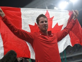 Canada's Derek Drouin celebrates winning the Men's High Jump Final during the athletics event at the Rio 2016 Olympic Games at the Olympic Stadium in Rio de Janeiro on August 16, 2016.  / AFP PHOTO / Johannes EISELEJOHANNES EISELE/AFP/Getty Images