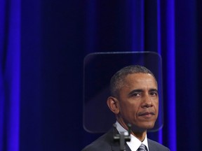 This file photo taken on February 27, 2015 shows U.S. President Barack Obama looking through a teleprompter during a ceremony for outgoing Attorney General Eric Holder at the Justice Department in Washington, D.C. (YURI GRIPAS/AFP/Getty Images)