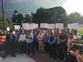 Taxi drivers outside East York Civic Centre protest against Uber and the city's licensing and standards division on Wednesday, Aug. 17, 2016. (Maryam Shah/Toronto Sun)