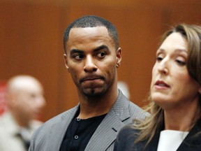 In this Feb. 20, 2014, file photo, Darren Sharper looks toward his attorney, Blair Berk, during an appearance in Los Angeles Superior Court in Los Angeles. Former NFL star Darren Sharper has been sentenced to 18 years and four months in prison in a case where he was accused of drugging and raping as many as 16 women in four states. (AP Photo/Mario Anzuoni, Pool, File)