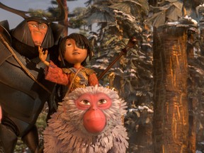 This image released by Focus Features shows characters Beetle, voiced by Matthew McConnaghey, Kubo, voiced by Art Parkinson and Monkey, voiced by Charlize Theron in a scene from the animated film, "Kubo and the Two Strings." (Laika Studios/Focus Features via AP)
