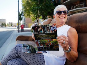 Luke Hendry/The Intelligencer
Store owner Kathryn Brown sits on a curbside couch on Front Street in Belleville Thursday. She's chairing an effort by the Belleville Downtown Improvement Area to launch a new street festival in October.