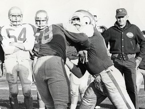 Neil Armstrong, shown here working with Edmonton high school students in 1968, went on the coach with the NFL Minnesota Vikings before becoming head coach of the Chicago Bears from 1978-81. (File)