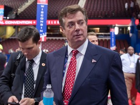 In this July 18, 2016, file photo, Trump campaign chairman Paul Manafort walks around the convention floor before the opening session of the Republican National Convention in Cleveland. Manafort resigned in wake of campaign shakeup and revelations about Ukraine work. (AP Photo/Carolyn Kaster, File)