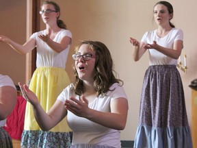 Lambton Youth Choir members Amber Daley, Aislinn Thomas and Megan McClintock perform at a recent spring concert at Grace United Church. The long-running choir has put out the call for more members heading into its next performance season. Handout/Sarnia Observer/Postmedia Network