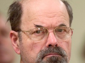 In this Oct. 12, 2005, file photo, convicted BTK killer Dennis Rader listens during a court proceeding in El Dorado, Kan. A 
new book says the BTK serial killer planned to kill an 11th victim by hanging her upside down in her Wichita, Kansas, home. It’s a story police heard from Dennis Rader himself in 2005, but decided at the time to suppress to protect the woman. The story was made public in “Confession of a Serial Killer: The Untold Story of Dennis Rader, the BTK Killer,” which has a scheduled release date of Sept. 6. (Travis Heying/The Wichita Eagle via AP, Pool)