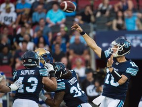 Toronto Argonauts quarterback Logan Kilgore passes the ball against the Winnipeg Blue Bombers during first half CFL football action in Toronto on Friday, August 12, 2016. (THE CANADIAN PRESS/Nathan Denette)