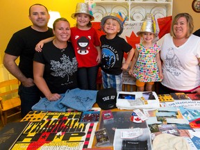 One extended London family are heading to Kingston for the celebrations of The Tragically Hip?s final show. Showing off their Hip paraphernalia are Chris Coombs, left, Megan Srigley, Kalei Coombs, 8, Ryder McClain, 5, Terren Coombs, Tara Srigley and Mike McClain. Chris Coombs and Mega Srigley got tickets to the show. (MIKE HENSEN, The London Free Press)