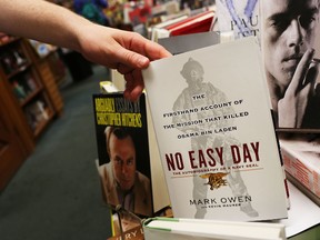 A copy of 'No Easy Day', an account of the killing of Osama Bin Laden on May 2, 2011 by the Navy SEALs who executed the mission, is viewed on the shelf of the bookstore Shakespeare and Company on September 4, 2012 in New York City. The controversial book by Mark Owen, a believed pen name for former SEAL Matt Bissonnette, was criticized by the Pentagon for breaching nondisclosure agreements. (Photo by Spencer Platt/Getty Images)