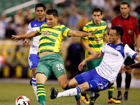 FC Edmonton midfielder Cristian Raudales challenges Tampa Bay Rowdies defender Darwin Espinal in the team's first meeting this season in Tampa, Florida. FC Edmonton face Tampa Bay on Saturday.