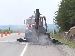 Firefighters responded to backhoe fire on Municipal Road 55 at Blueberry Hill in Naughton, Ont. on Friday August 19, 2016. Billows of black smoke could be seen rising into the air. John Lappa/Sudbury Star/Postmedia Network