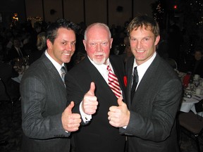 Former Leafs Doug Gilmour, left, and Kirk Muller, right, were ecstatic last night when fellow Kingston native Don Cherry showed up as a surprise guest for a hometown party honouring two NHL greats.