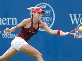 Angelique Kerber of Germany hits a return shot to Simona Halep of Romania during their semifinal match on Day 8 of the Western & Southern Open at the Lindner Family Tennis Center on August 20, 2016 in Mason, Ohio. Kerber defeated Halep 6-3, 6-4. (Joe Robbins/Getty Images)