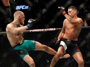Conor McGregor kicks Nate Diaz during their welterweight rematch at the UFC 202 event at T-Mobile Arena on August 20, 2016 in Las Vegas, Nevada. (Steve Marcus/Getty Images)