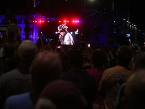 The Tragically Hip's frontman Gord Downie is seen on a screen in Springer Market Square in downtown Kingston. The Hip's concert at the KRock Centre in the Kingston on Saturday, Aug. 20 was broadcast nationally on CBC. Elliot Ferguson/The Whig-Standard