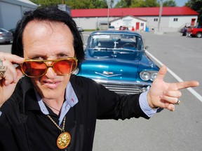 Luke Hendry/The Intelligencer
Elvis tribute artist Berry Chumbley, 56, of Corbyville strikes a pose in front of his 1958 Chevrolet Bel-Air outside the Land O'Lakes Curling Club in Tweed Saturday. He was one of 26 competitors in the sixth-annual Tweed Tribute to Elvis festival.