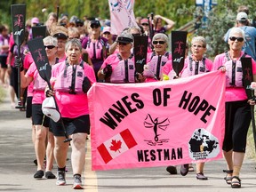 Cancer survivors take part during the Pink Ribbon Challenge at the Edmonton Dragon Boat Festival in Edmonton on Sunday, Aug. 21, 2016.
