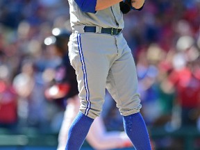 Blue Jays relief pitcher Brett Cecil reacts after giving up a two-run home run to Jose Ramirez of the Cleveland Indians in the eighth inning on Aug. 21, 2016, in Cleveland. (DAVID DERMER/AP)